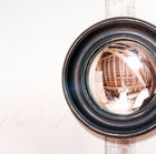 Discreet mirror in a Bohemian country style.