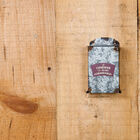 Cenicero metálico de interior.