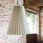 Large retro luminaire made of pleated cardboard paper.