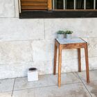 Pretty side table in white marble and dark wood.