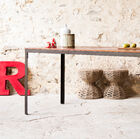 A table with a delicately industrial design.