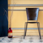 A metal chair with an industrial look, beautiful lines and comfortable