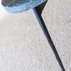 Hand hammered metal base for an organic look.