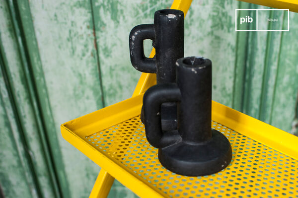 The shelves are perforated for an industrial style.