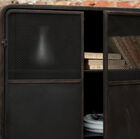 Double door in black openwork metal.