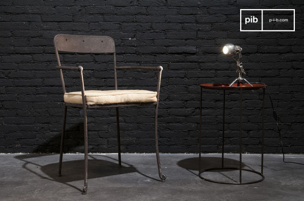 Nice chair with dark metal armrests.