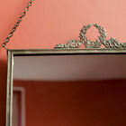 Mirror with a deliciously retro metallic frame.