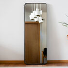 Large rectangular mirror with a metallic black frame and rounded corners.