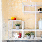 A beautiful white wire mesh wall library.