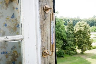 Brass wall-mounted thermometer