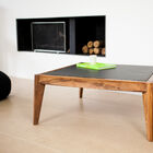 A beautiful coffee table in wood and imitation leather.