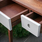 Three white drawers add a luminous touch.