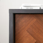 Distinguished by its dark smoky gray exterior and natural walnut fronts