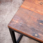 Recycled solid wood makes the table unique.