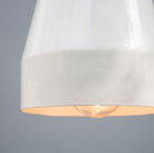 The lampshade is made of bright white metal.