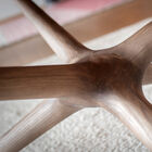 Its three legs extended by three arms form a star-shaped composition