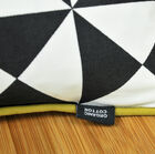 A small cushion made entirely of organically-grown cotton