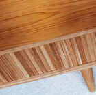 On both sides of the table is a storage space perfect to store some books and remote controls