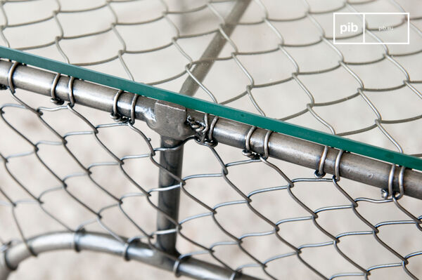 The top is a solid glass panel with polished and rounded edges.