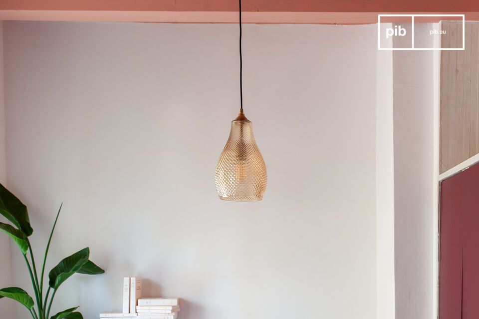 With its subtly orange-tinted glass and brass finishes