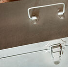 The box is topped by a handle, allowing easy transport.