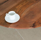 The table has an unique colour combination: the round legs are faceted at the end and are painted