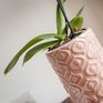 A pink ceramic vase worked in a vintage style full of softness