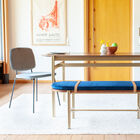 With its rich walnut colour and matt gold base, this table will add a charming touch to any space