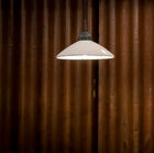 The lampshade is made of cream-coloured glazed ceramic.