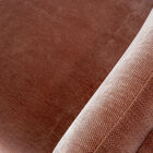 Its low seat and solid sides create a strong visual anchor