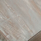 the top is patinated grey white by applying successive layers.