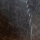 The dark chocolate hue of its full-grain aniline leather adds a note of depth to its look