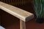 The solid wood armrest retains its organic character.
