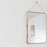 Brass mirror plated with a silver alloy.