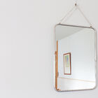 Brass mirror plated with a silver alloy.