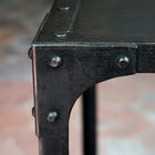 Riveted edges for a raw and uncompromising appearance.