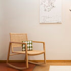 Rocking-chair armchair with a wooden structure and rounded corners.