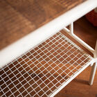 The pretty bench has two levels to maximize storage.