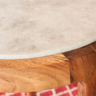 A top offers a beautiful contrast between marble and dark wood.