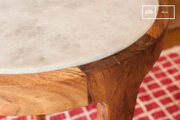 A top offers a beautiful contrast between marble and dark wood.