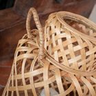 The lantern is hand-woven in pretty diamond patterns.