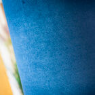 Soft blue shade that contrasts with the gold of the foot.