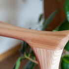 The light wood structure presents a meticulous cabinet-making work.