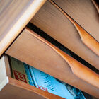 Combining four drawers of original design with shelves hidden behind a sliding door
