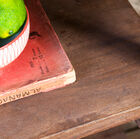 The dark solid wood shelf reveals the natural look of the wood.