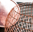 Side table with a spherical mesh structure.