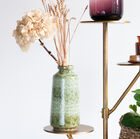 The stand has elegant round shelves.