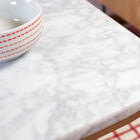 White marble top with ribs that make each table unique.