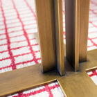 Delicate base in naturally gilded brass.