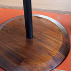 The base is made of solid dark wood.